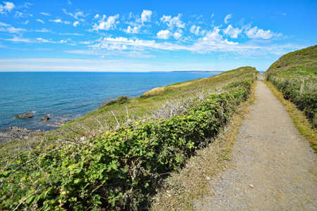 Westward Ho!, North Devon, England 5th July 2017 - Looking East toward the coastal town of Westward Ho! ( about 1 mile away ) on the Southwest Coast  National Trail Path.のeditorial素材