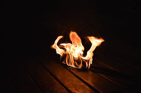 totch fire, flame over black background on the ground