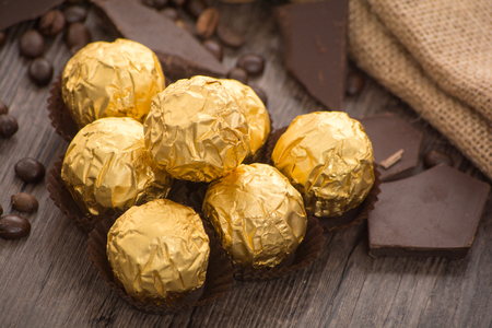 Italian chocolate sweets with decoration on the wooden tableの写真素材