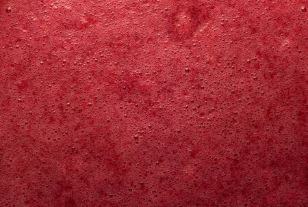 Sweet foam in the preparation of red currant jamの写真素材