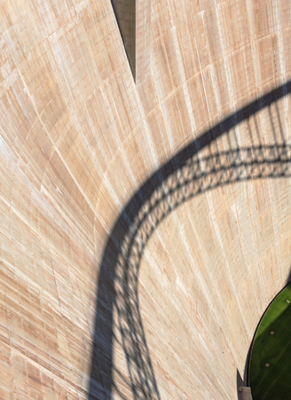 The wall of the dam with the shadow of the bridge on it. Arizona, USの写真素材