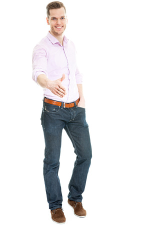 Offering a handshake - young man isolated on white full body shotの写真素材