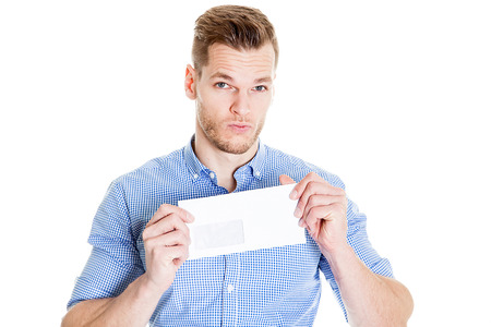 young businessman holds in hand an envelope on a white backgroundの写真素材