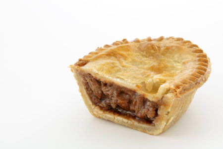 Savoury meat pie with a beef filling studio isolated