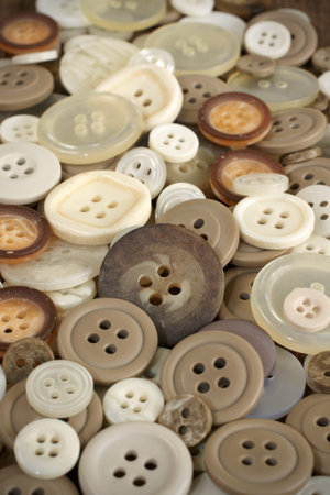 Stack of old fashioned brown beige and white buttonsの写真素材