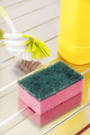 Nylon pan scourer on a stainless steel drainerの写真素材