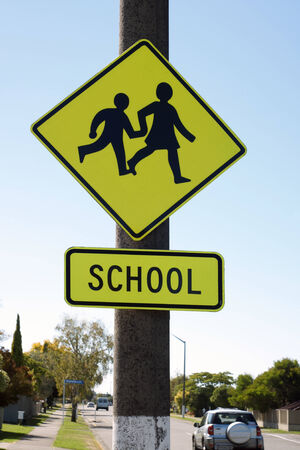 School crossing sign warning drivers they are entering a school zoneの写真素材