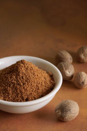 Whole and ground nutmegの写真素材