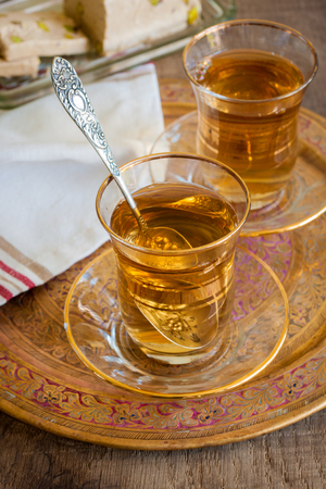 Turkish apple tea a sweet apple flavoured beverage served in Turkish tea glassesの写真素材