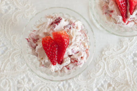 Eton mess a traditional English summer dessert made with strawberries raspberries meringue and cream top down viewの写真素材