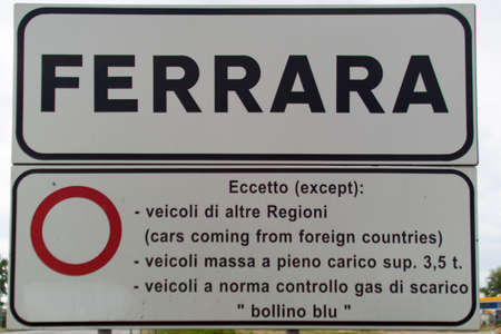 road sign with the name of the city ferraraの写真素材