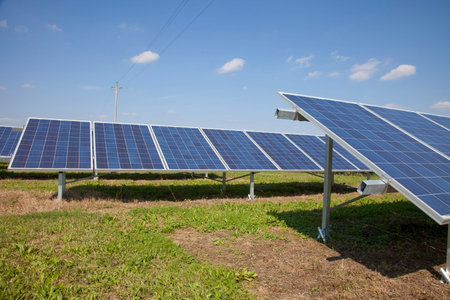 Ecology electric energy farm with solar panel battery in green field