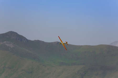 VAL DI FASSA â COL DEL CUC, ITALY - JULY 28: Radio controlled model airplane in flight in a Euromeeting Fly, July 28, 2013 in Val Di Fassa, Pordoi, Col del Cuc, Italyのeditorial素材