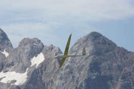 VAL DI FASSA â COL DEL CUC, ITALY - JULY 28: Radio controlled model airplane in flight in a Euromeeting Fly, July 28, 2013 in Val Di Fassa, Pordoi, Col del Cuc, Italyのeditorial素材