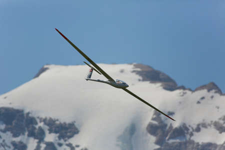 VAL DI FASSA â COL DEL CUC, ITALY - JULY 28: Radio controlled model airplane in flight in a Euromeeting Fly, July 28, 2013 in Val Di Fassa, Pordoi, Col del Cuc, Italyのeditorial素材