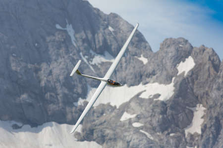 VAL DI FASSA â COL DEL CUC, ITALY - JULY 28: Radio controlled model airplane in flight in a Euromeeting Fly, July 28, 2013 in Val Di Fassa, Pordoi, Col del Cuc, Italyのeditorial素材