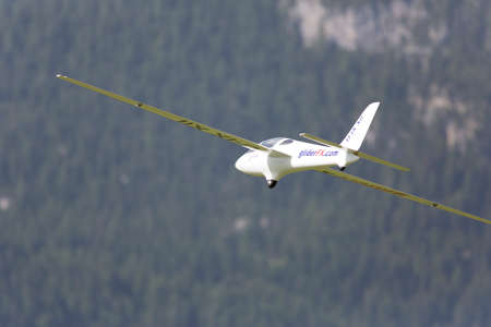 VAL DI FASSA â COL DEL CUC, ITALY - JULY 28: Radio controlled model airplane in flight in a Euromeeting Fly, July 28, 2013 in Val Di Fassa, Pordoi, Col del Cuc, Italyのeditorial素材