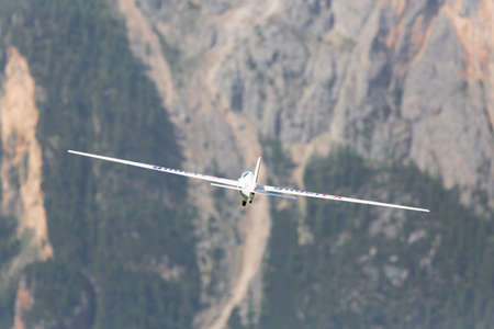 VAL DI FASSA â COL DEL CUC, ITALY - JULY 28: Radio controlled model airplane in flight in a Euromeeting Fly, July 28, 2013 in Val Di Fassa, Pordoi, Col del Cuc, Italyのeditorial素材