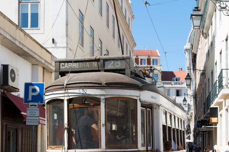 Lisbon, Portugal - August 5, 2014: Traditional yellow tram downtown Lisbon, Trams are used by everyone and also keep the traditional style of the historic center of Lisbon.のeditorial素材