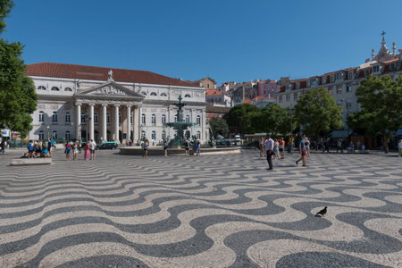 Lisbon, Portugal - August 5, 2014: Dona Maria II National Theatre and fountain in Rossio (Dom Pedro IV) Square, the main square of Lisbonのeditorial素材