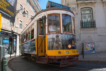 Lisbon, Portugal - August 5, 2014: Traditional yellow tram downtown Lisbon, Trams are used by everyone and also keep the traditional style of the historic center of Lisbon.のeditorial素材