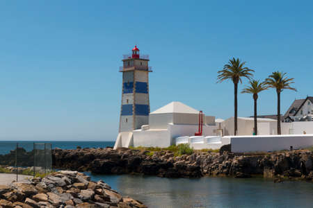 Lighthouse and reflex on seaの写真素材