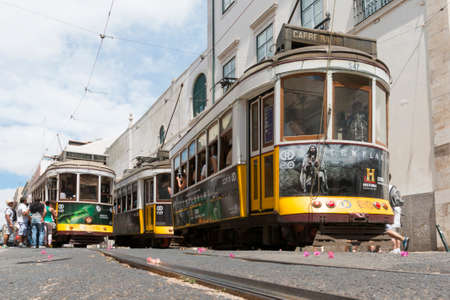 Lisbon, Portugal - August 9, 2014: Traditional yellow tram downtown Lisbon, Trams are used by everyone and also keep the traditional style of the historic center of Lisbon.のeditorial素材