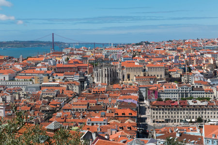 Panorama of old traditional city of Lisbon with red roofs and view of river Tagusの写真素材