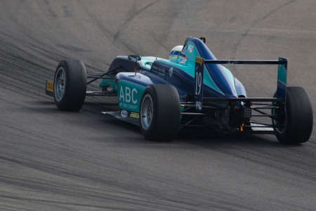 Imola, Italy - October 11, 2014: A Tatuus F.4 T014 Abarth of Cram Motorsport team, driven By Haxhiu Edi (Che),  the Italian F4 Championship car racing on October 11, 2014 in Imola, Italy.のeditorial素材
