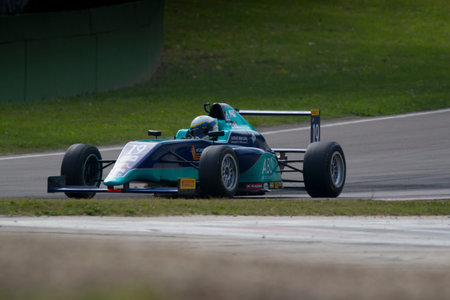 Imola, Italy - October 11, 2014: A Tatuus F.4 T014 Abarth of Cram Motorsport team, driven By Haxhiu Edi (Che),  the Italian F4 Championship car racing on October 11, 2014 in Imola, Italy.のeditorial素材