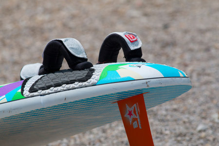 LAKE OF SANTA CROCE, ITALY - JULY 13, 2014: A kitesurfboard in the beachLAKE OF SANTA CROCEのeditorial素材