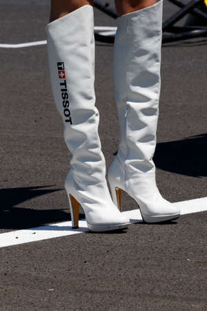 MISANO ADRIATICO, ITALY - JUNE 21, 2015: A grid girl poses during the Superbike race 2 during the FIM Superbike World Championship - Race at Misano World Circuit on June 21, 2015 in Misano Adriatico, Italy.のeditorial素材