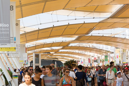 Milan, Italy, 12 August 2015: visitors walking under the tensile roof covering main walk at exhibition Expo 2015 Italyのeditorial素材
