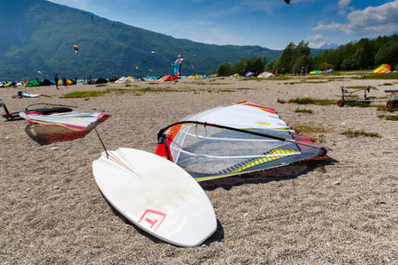 Lake Of Santa Croce, Italy â May 21, 2016: windsurfing sport equipment on Lake of Santa Croce Beach, Alpago, Belluno, Veneto, Italyのeditorial素材
