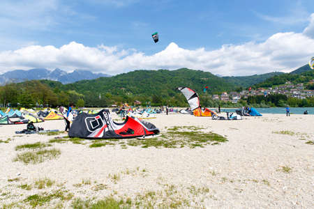 Lake Of Santa Croce, Italy â May 21, 2016: Kitesurfing action at the lake. Preparation, starting from the beach, sailing in the lakeのeditorial素材