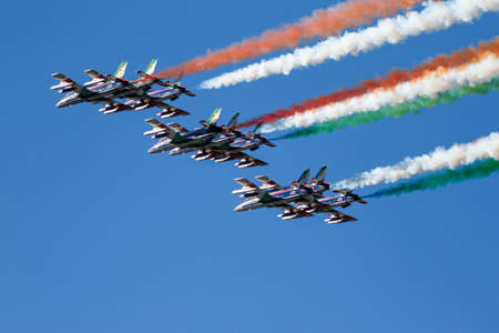 Alta Badia, Italy 20 December 2015: Italian special unit airforce 'Frecce Tricolori' (Tri-colour Arrows) spread smoke with the colours of the Italian flag during the Audi Fis Alpine Skiing World Cup Menâs Giant Slalom Race.のeditorial素材
