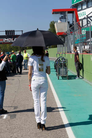 Imola, Italy - September 25, 2016: A grid girl poses during the Porsche Carrera Cup Italia - Race in Imola at Enzo & Dino Ferrari Circuit on September 25, 2016 in Imola, Italy.のeditorial素材