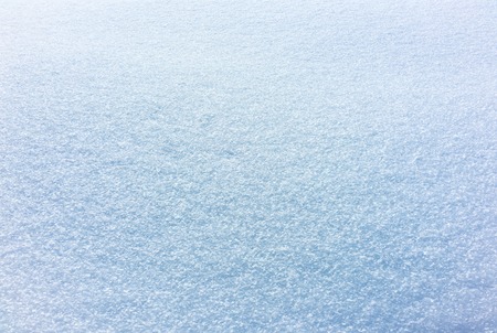 Snowy background with blue tint with light and shadow volumeの写真素材