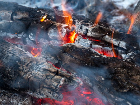 Firewood, weakly burning in the fire, close-upの写真素材