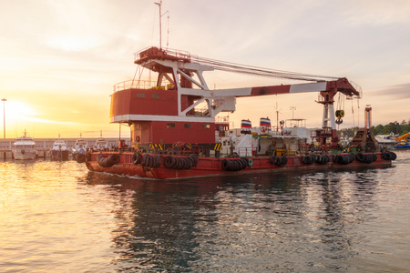 Large barge with a powerful 100 ton crane in the portの写真素材