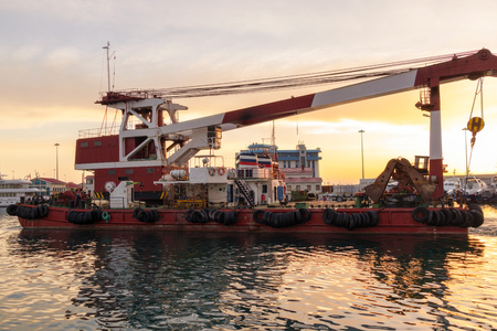 Large barge with a powerful 100 ton crane in the portの写真素材