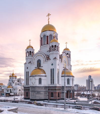 Temple in winter in beautiful pink sunset light. Temple-on Blood, Yekaterinburg, Russiaの写真素材
