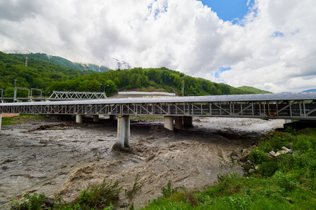 The powerful flow of a mountain river in the spring. Spring floodの写真素材