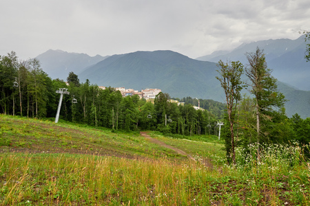 The green slope of the mountain with the cable cars in summer.の写真素材