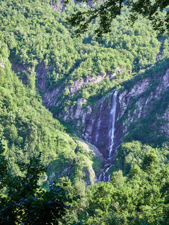 Majestic views of the green mountains with rocks and the highest waterfallの写真素材