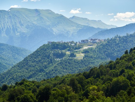 The complex in the mountains among the green forest. Krasnaya Polyana, Sochi, Russiaの写真素材