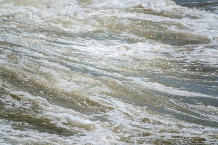 Sea wave during storm at Black sea in Sochi, Russia. Muddy sea waves with foam.の写真素材