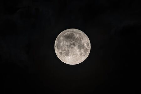 Detailed image of the full moon. Full moon against the black night sky.の写真素材
