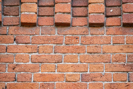 Fragment of a 19th century brick wall. Vintage bricks. Old wall.