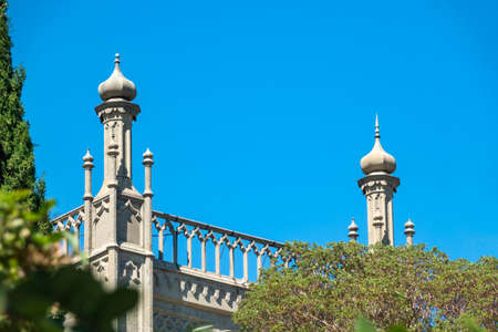 The walls of the old palace on the background of a blue sky. Vorontsov Palace, or the Alupka Palace is a historic palace situated at the foot of the Crimean Mountains near town of Alupka, Crimea.のeditorial素材
